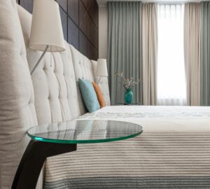 A stylish and cozy modern bedroom featuring elegant decor and soft lighting, perfect for relaxation.